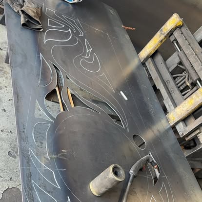 Steel plate marked out and plasma cut with a flame design