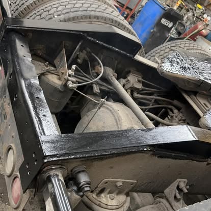 Reinforced and repainted truck frame after welding repair