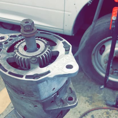 Disassembled hydraulic pump gear housing during a field repair