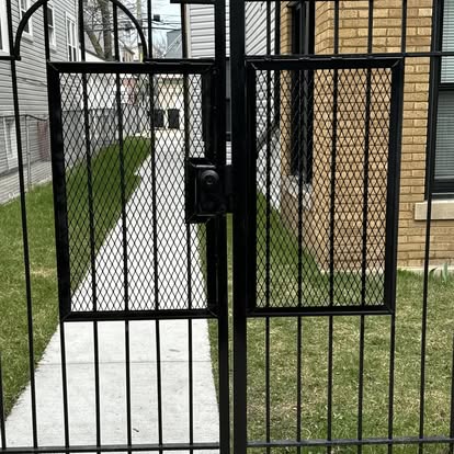 Custom black iron walkway gate fabricated and installed in Chicago