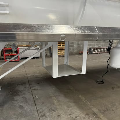 Polished aluminum trailer frame and support structure in the shop